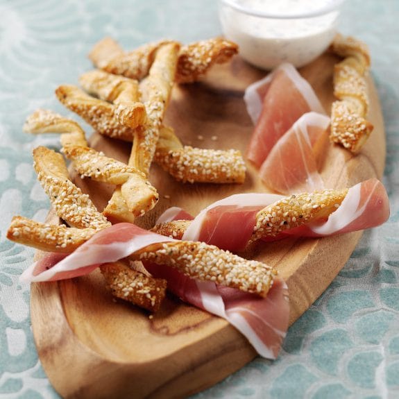 Parmesan cheese straws wrapped in Parma Ham with cream chive and chive dipping sauce